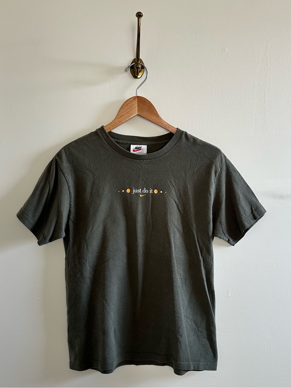 Vintage Nike, olive green graphic tshirt with circle pattern on back- L